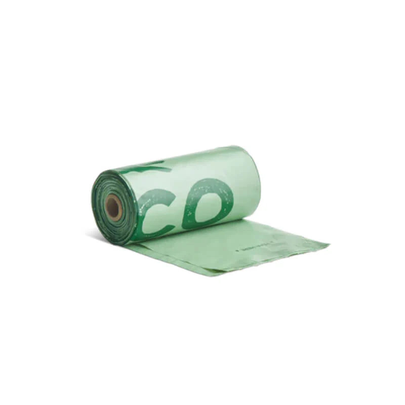 Roll of green plastic sheeting on a white background