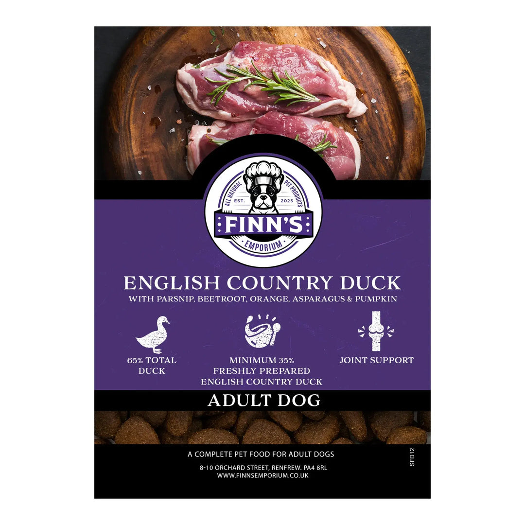 Finn's English Country Duck dog food package with raw duck on a wooden board.