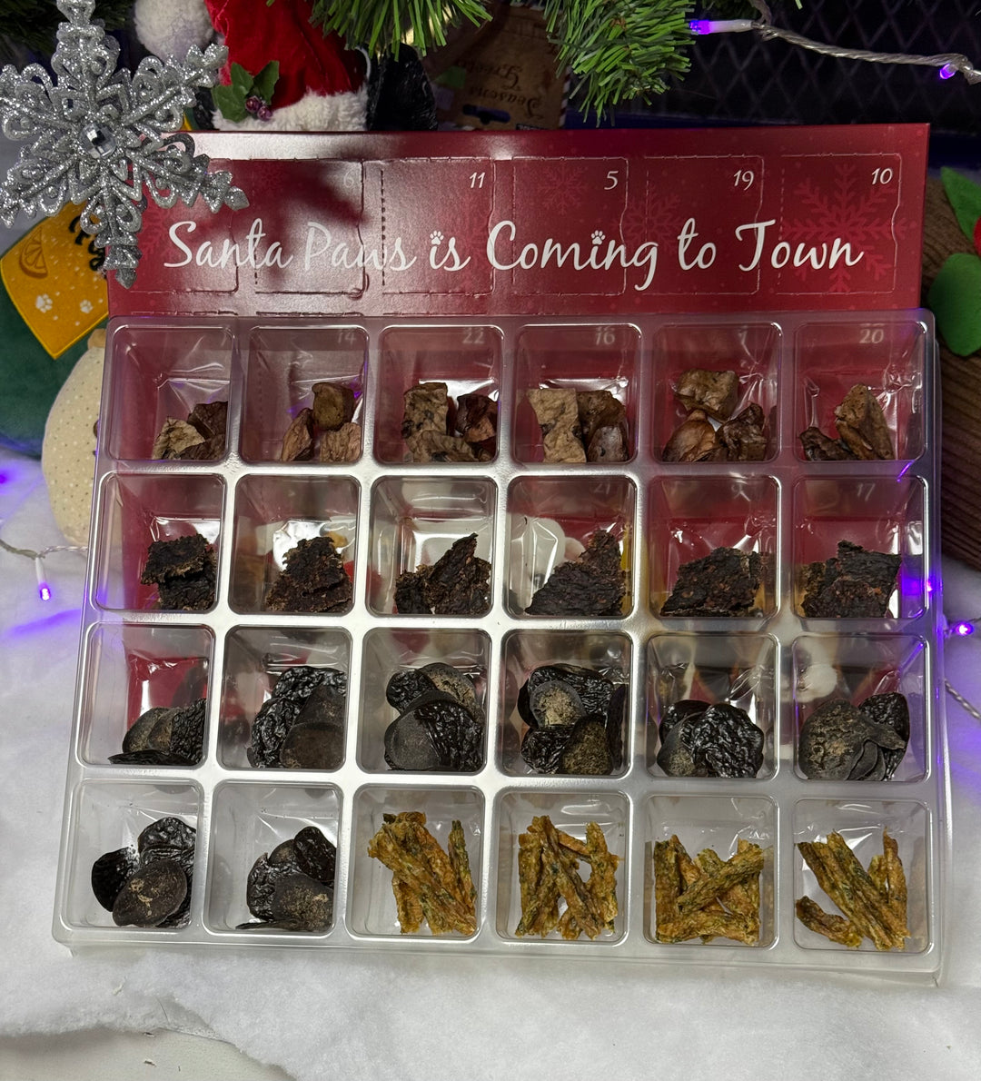 advent calendar with natural dog treats and christmas background
